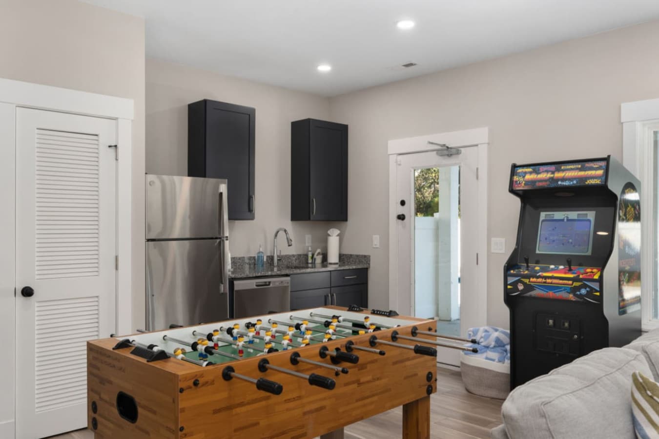 Game room corner w/ foosball table & extra entertainment space.