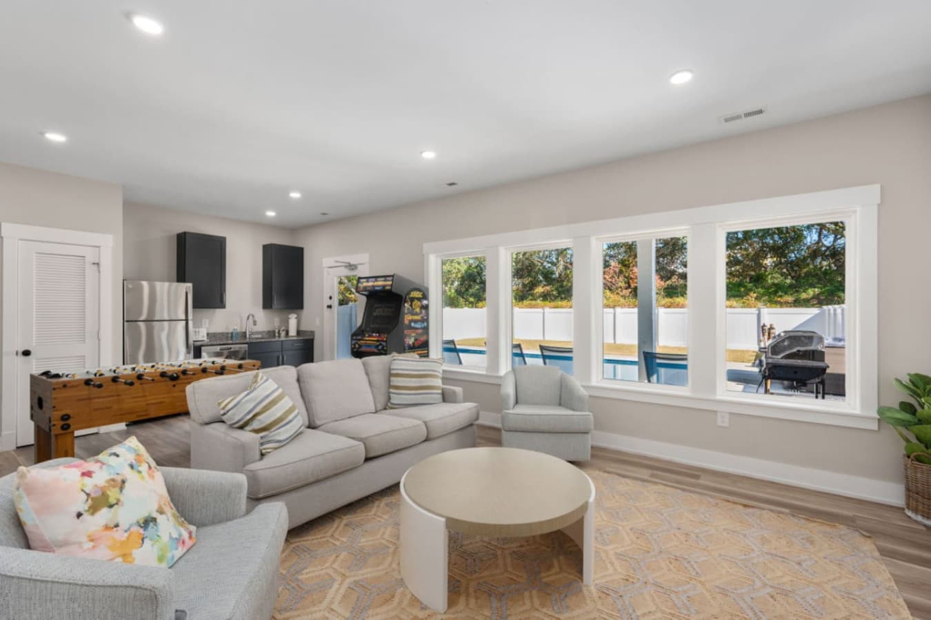 Bright lounge area w/ sectional seating & large windows all around.
