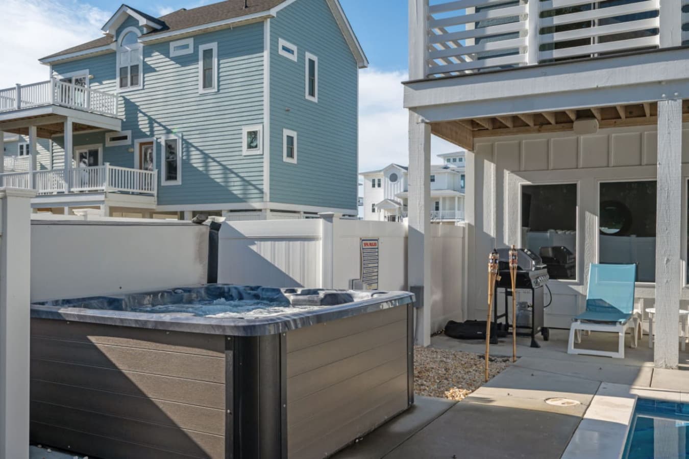 Backyard hangout w/ covered space, seating & easy outdoor flow.