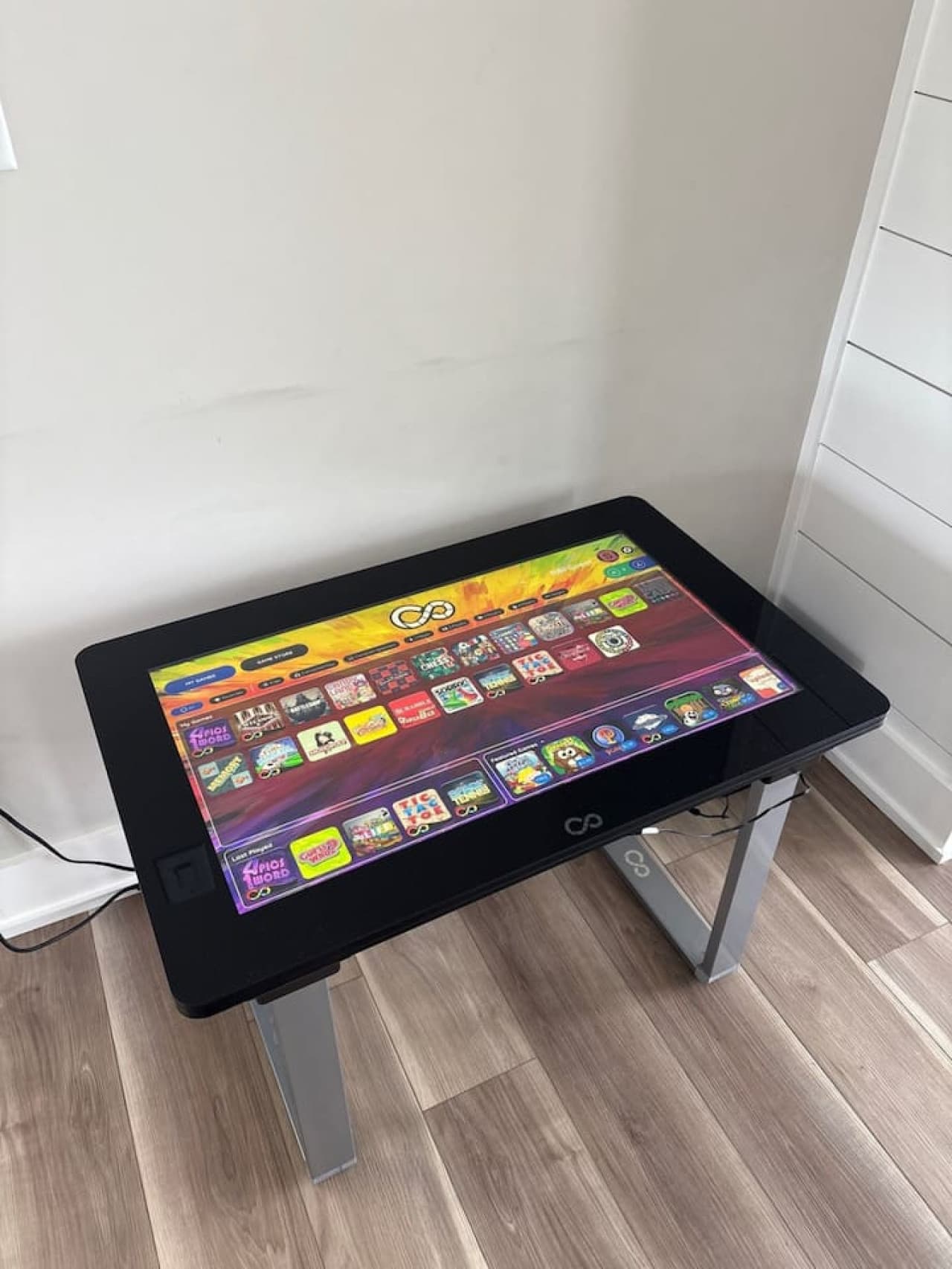 Touchscreen infinity game table loaded with games for rainy afternoons indoors.