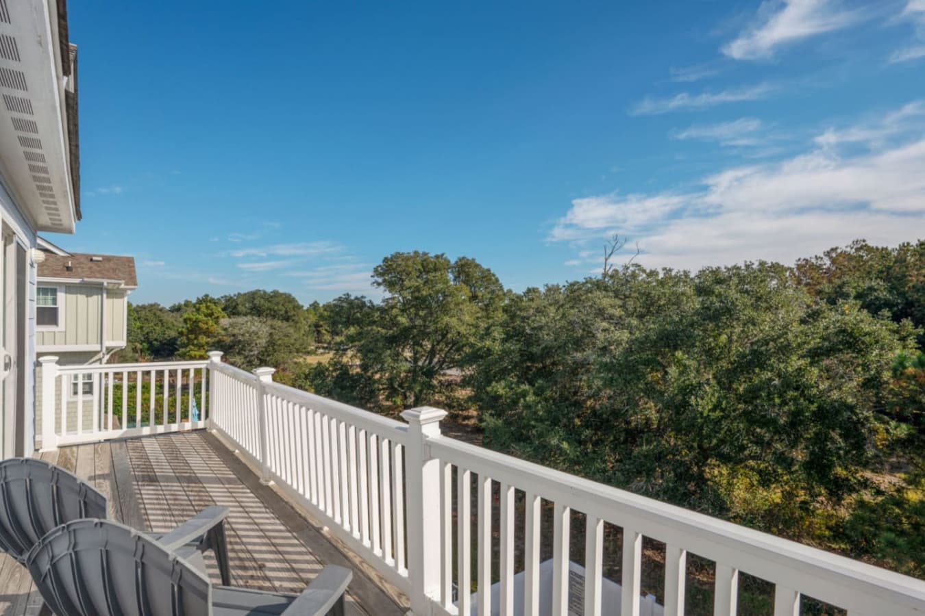 Elevated balcony overlooking treetops, great for quiet morning coffee