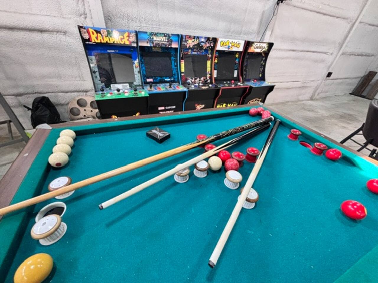 This game room is one of a kind with a 10 foot video wall and multiple games to come enjoy!