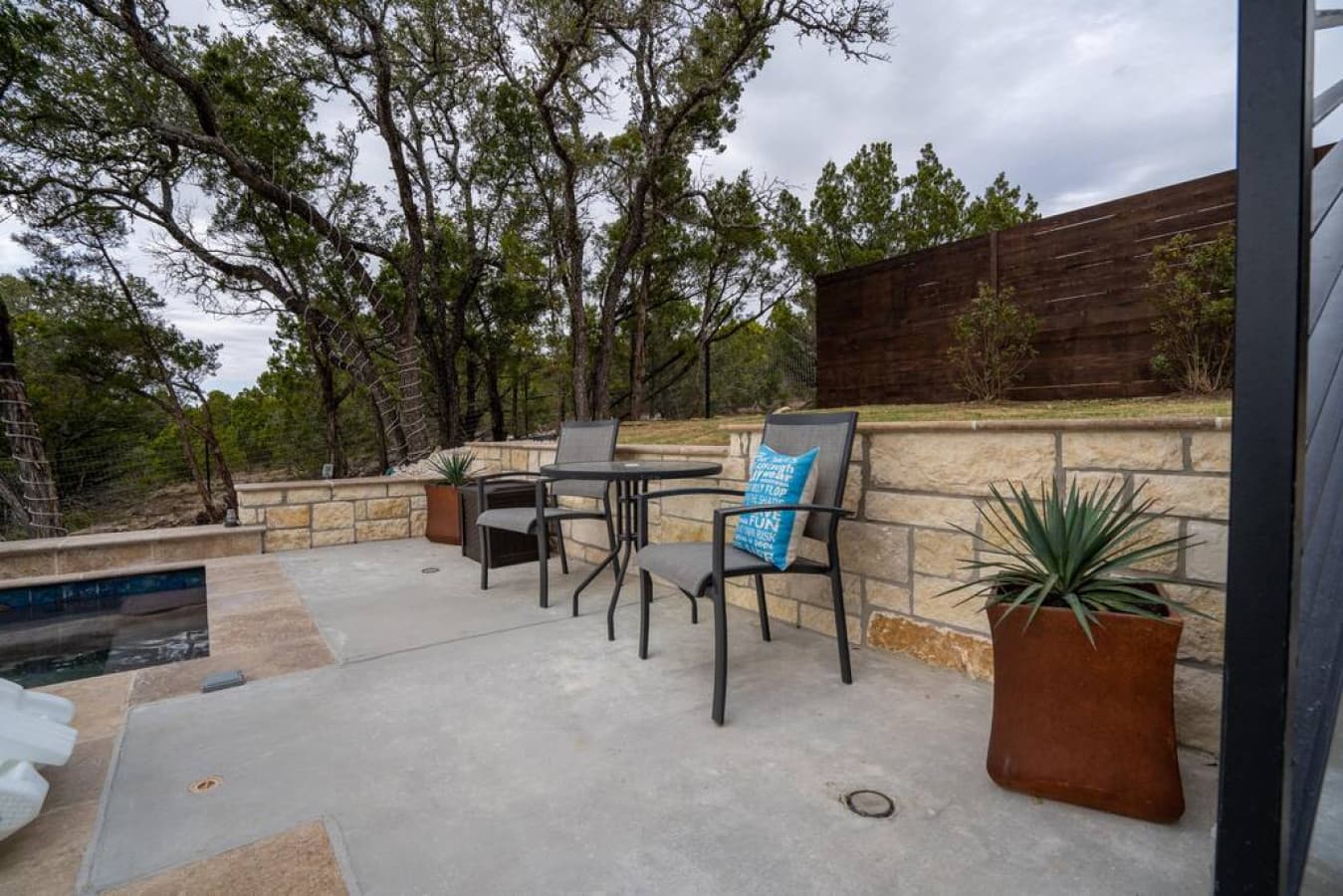 Have some wine and converse  with those sitting in the hot tub below.