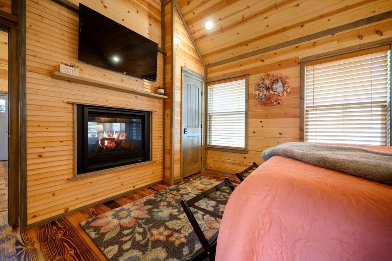 TV and fireplace in bedroom. Fireplace is dual sided for bedroom & living room