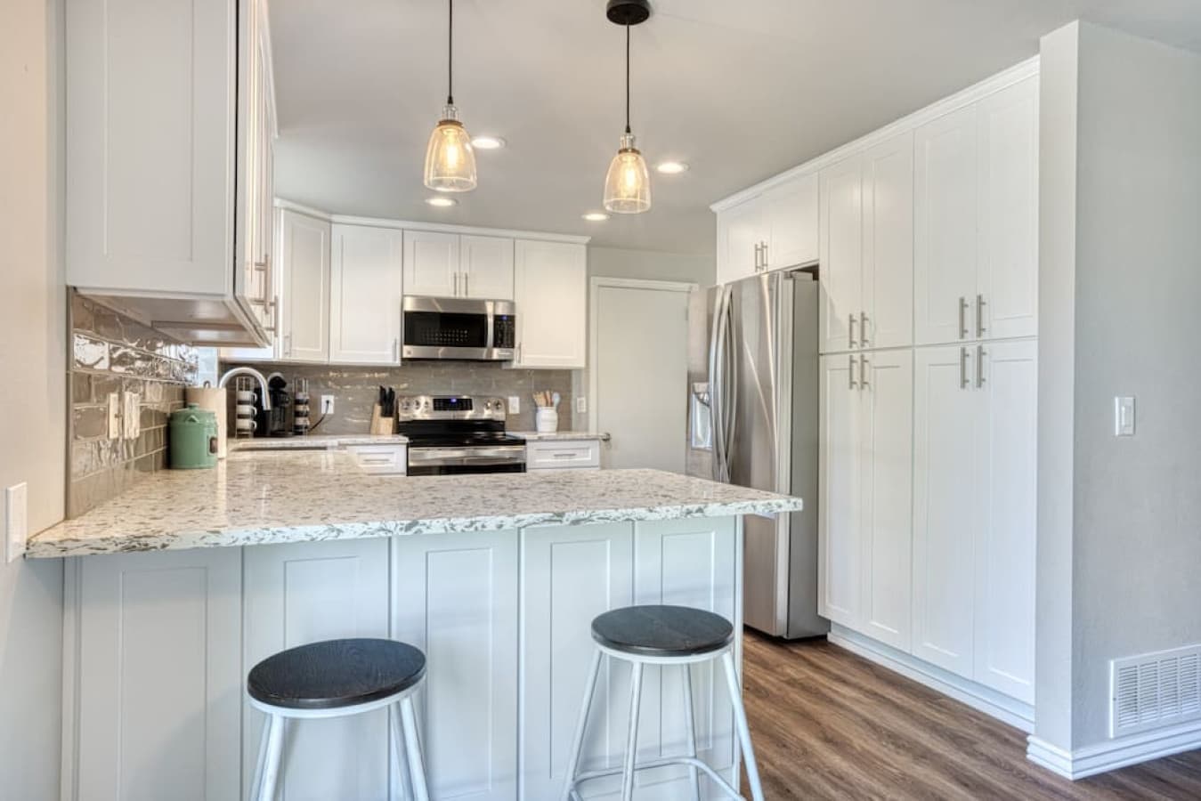 2 barstools at the breakfast bar for total meal seating for 8