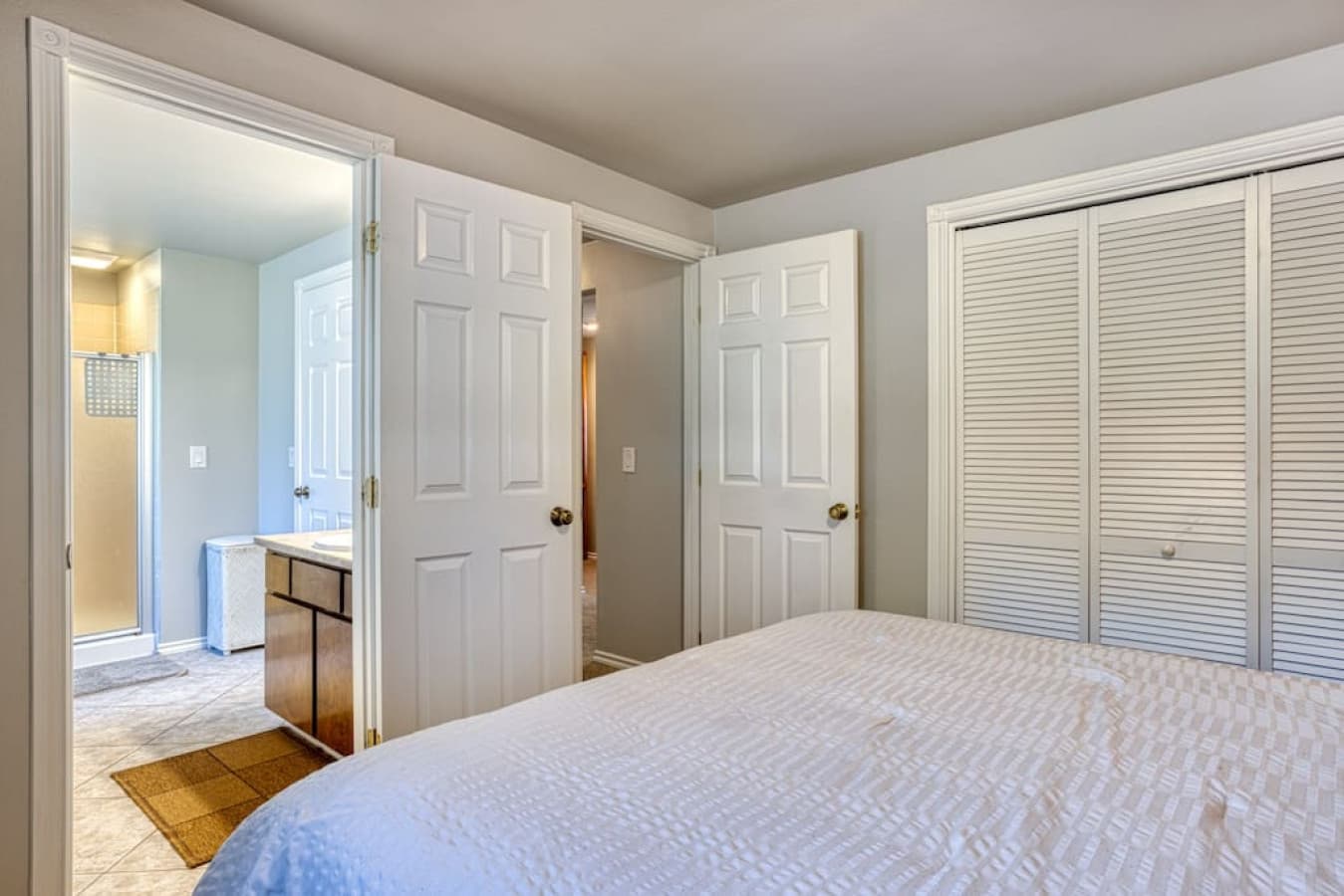 Private door to full bath + laundry room in queen guest bedroom 1 floor below the main floor