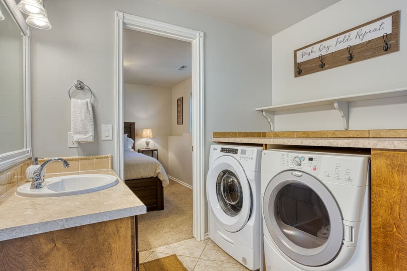 Laundry units + folding counter in full bathroom, 1 floor below main floor