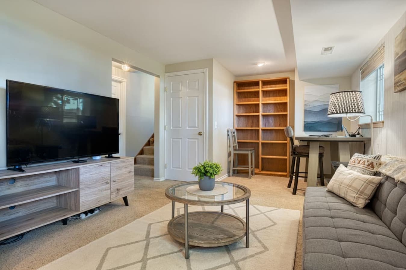 View of dedicated workspace near living room area 1 level down from the main floor