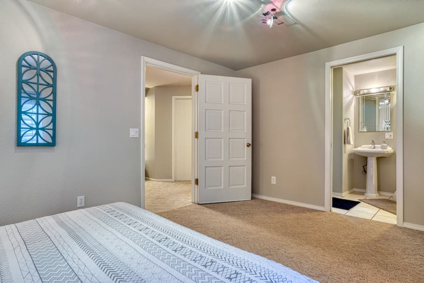 View towards door to private full bathroom in bottom floor king bedroom