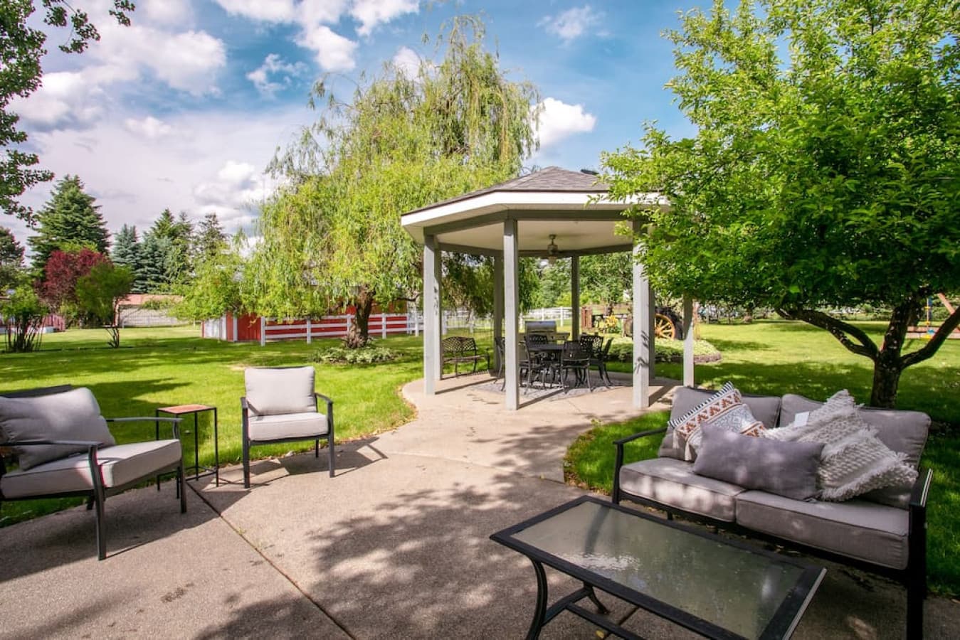 Outdoor seating & gazebo with dining table and bbq