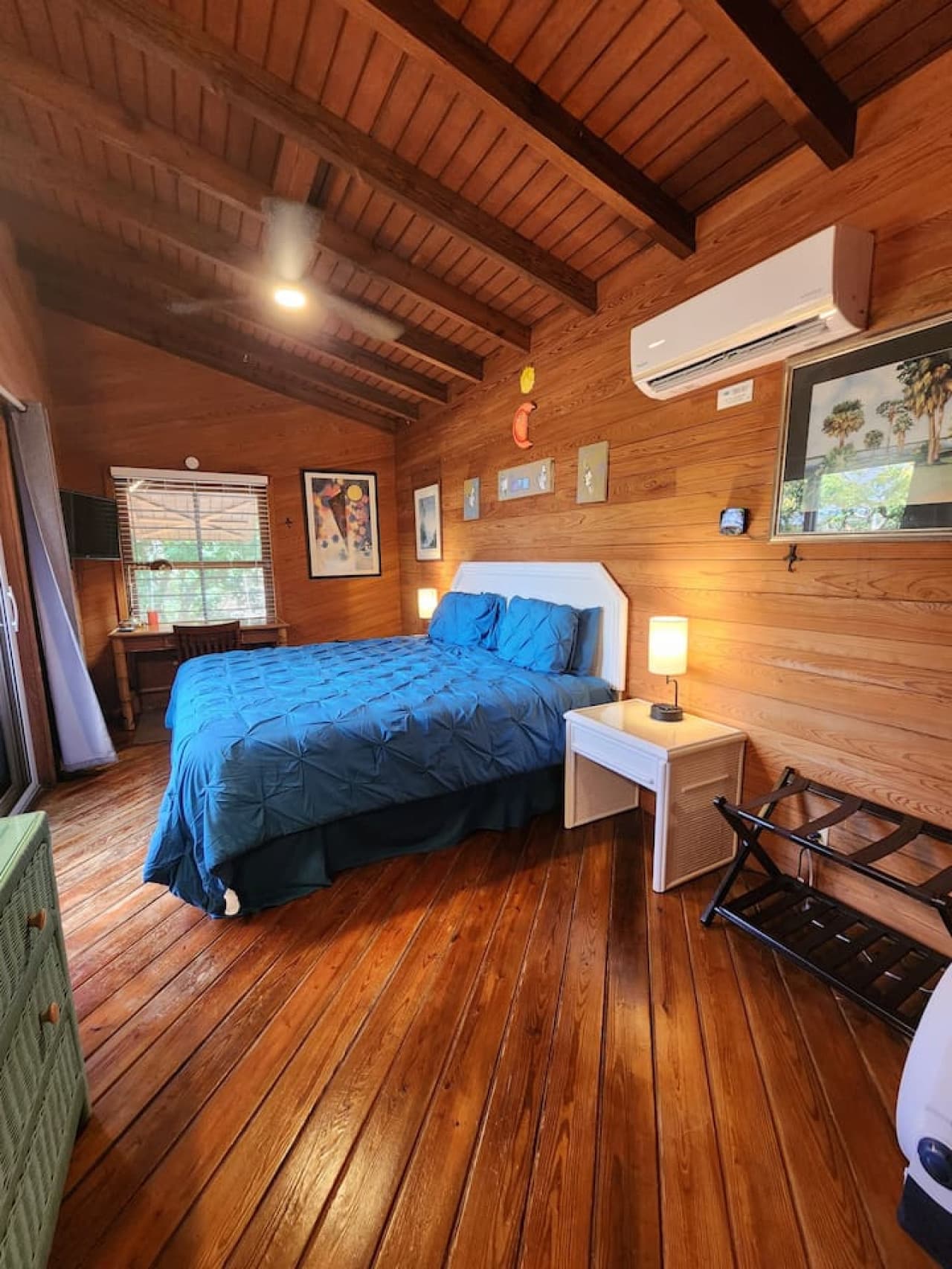 Main floor end bedroom with new king pillow top mattress and desk. Walk out slider to hot tub & deck!