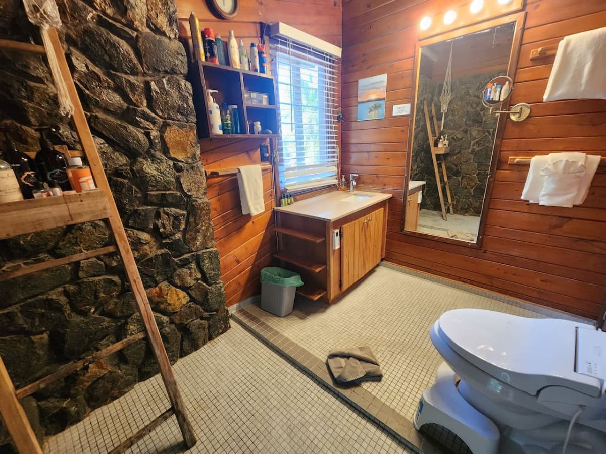 Main floor bath with bidet, local rock wall and rain shower!