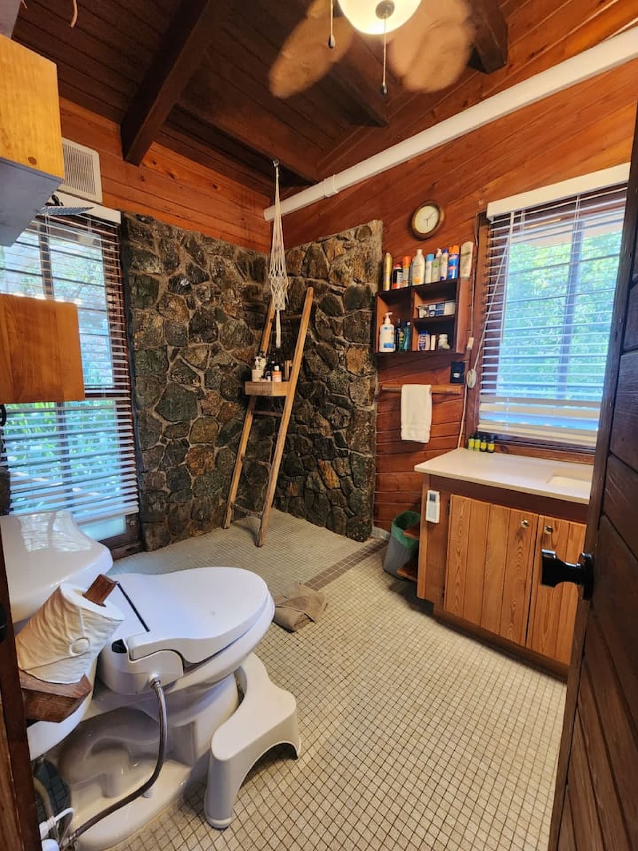 Main floor bath with bidet, local rock wall and rain shower!
