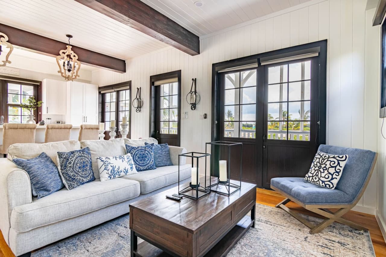 Living room showing french doors to 1st floor screened in balcony.