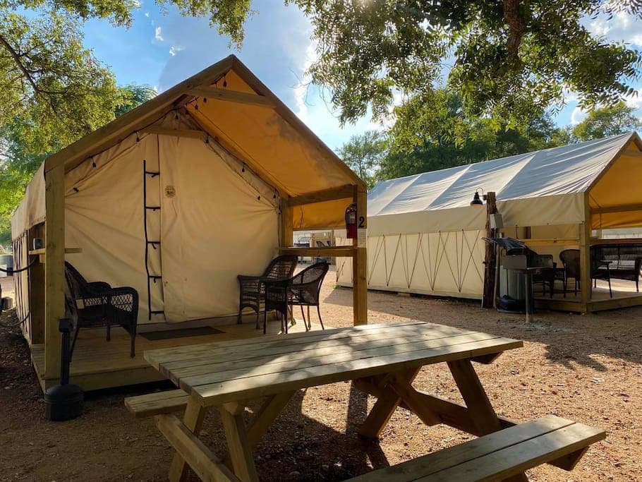 Nice and comfortable cabins with chairs, bench seat, and table