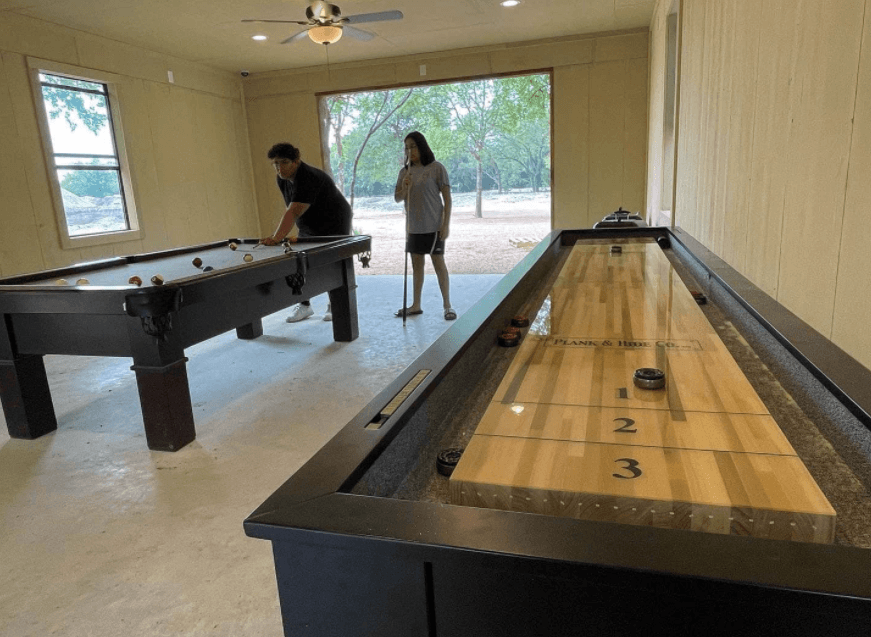 The game room has: shuffle board, foosball, pool table & ping pong table! 