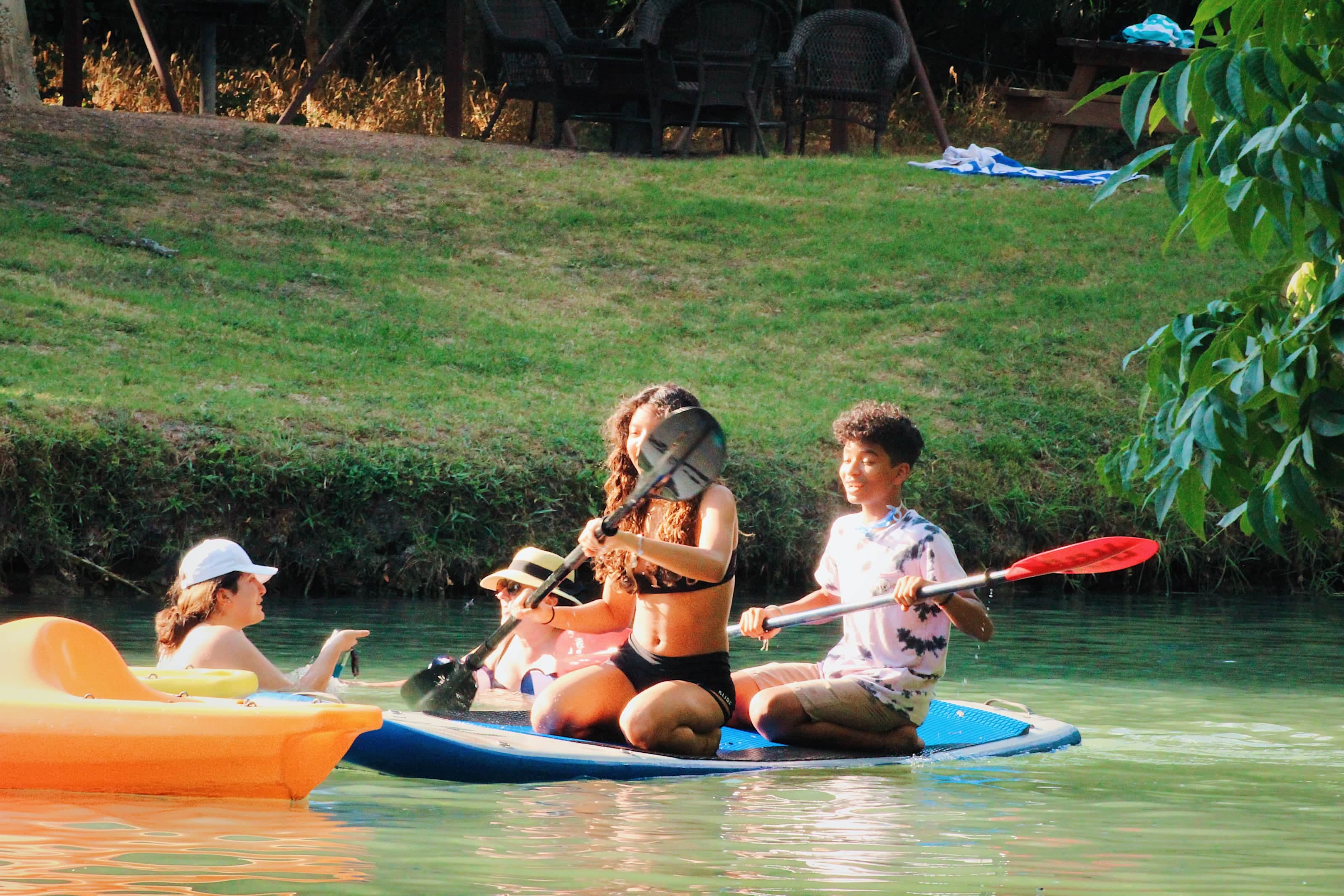 Kids & Adults love to kayak & paddleboard Geronimo Creek