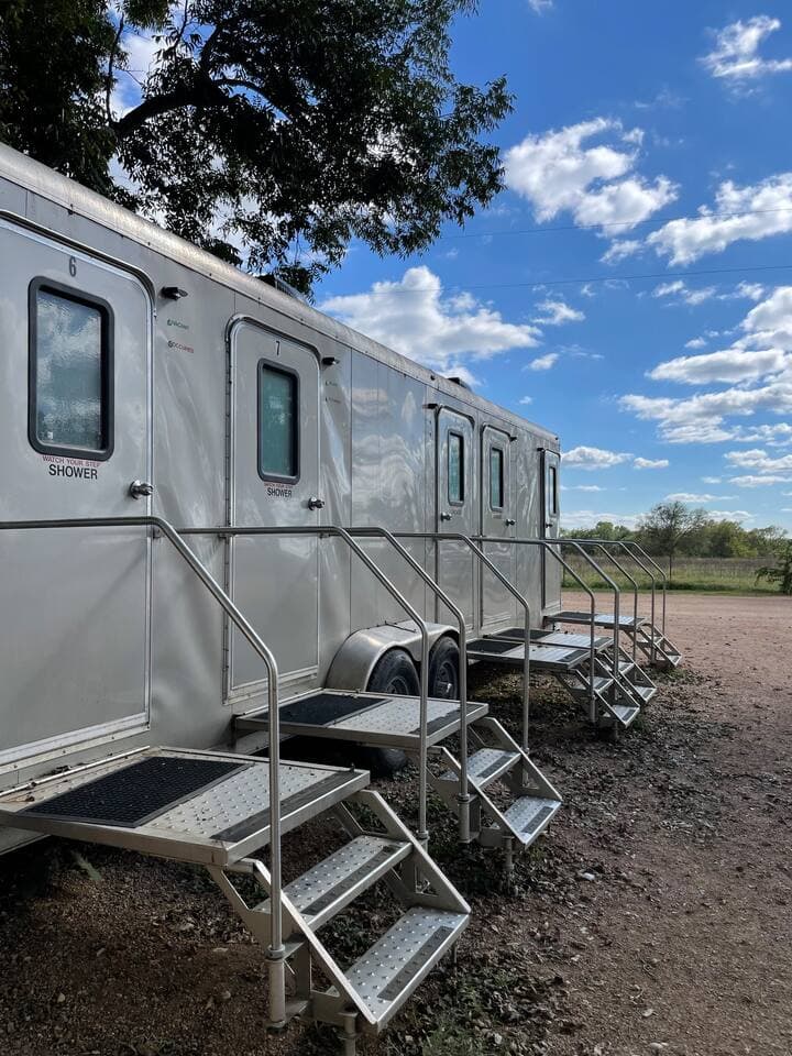 We have 2 trailers on the Island with 6 private, lockable full bathrooms with hot shower.
