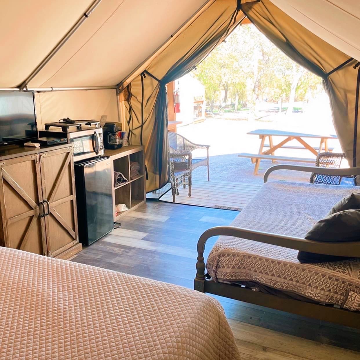 Open the tent and enjoy the view from inside the cabin.