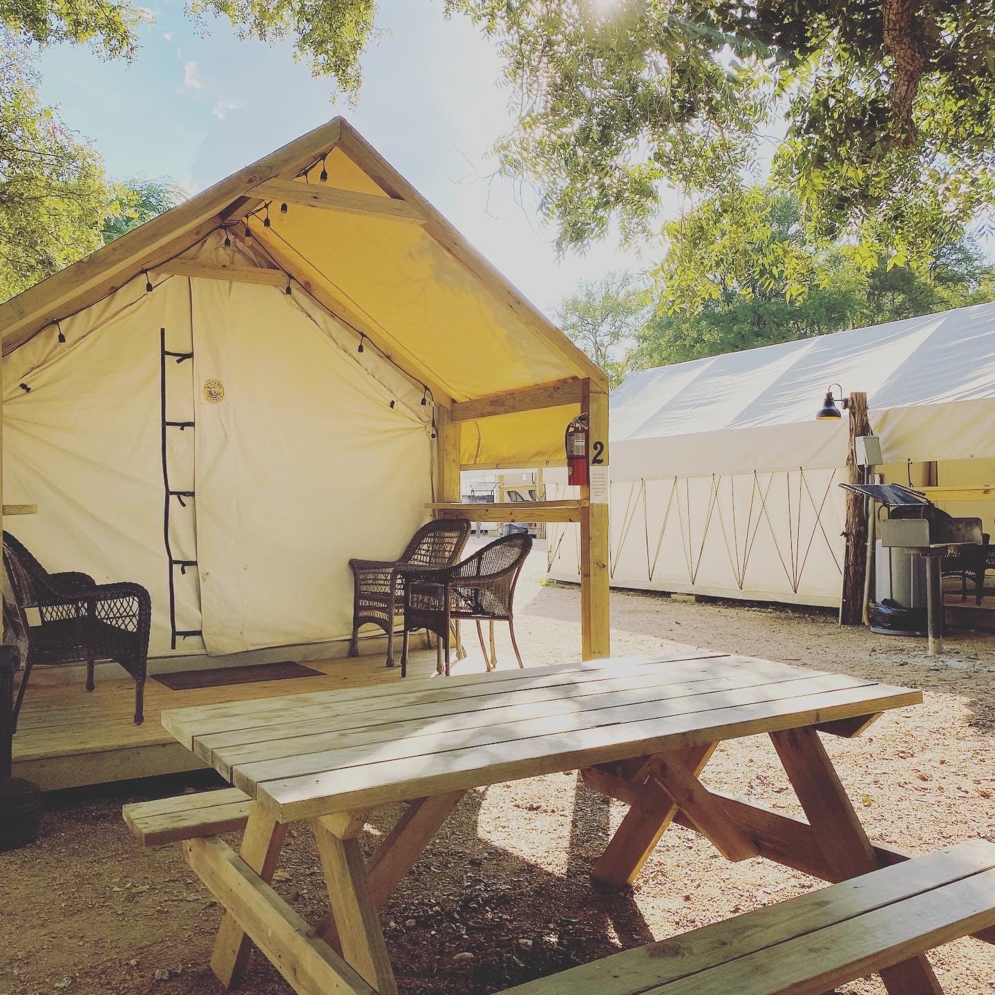Nice and comfortable cabins with chairs, bench seat, and table