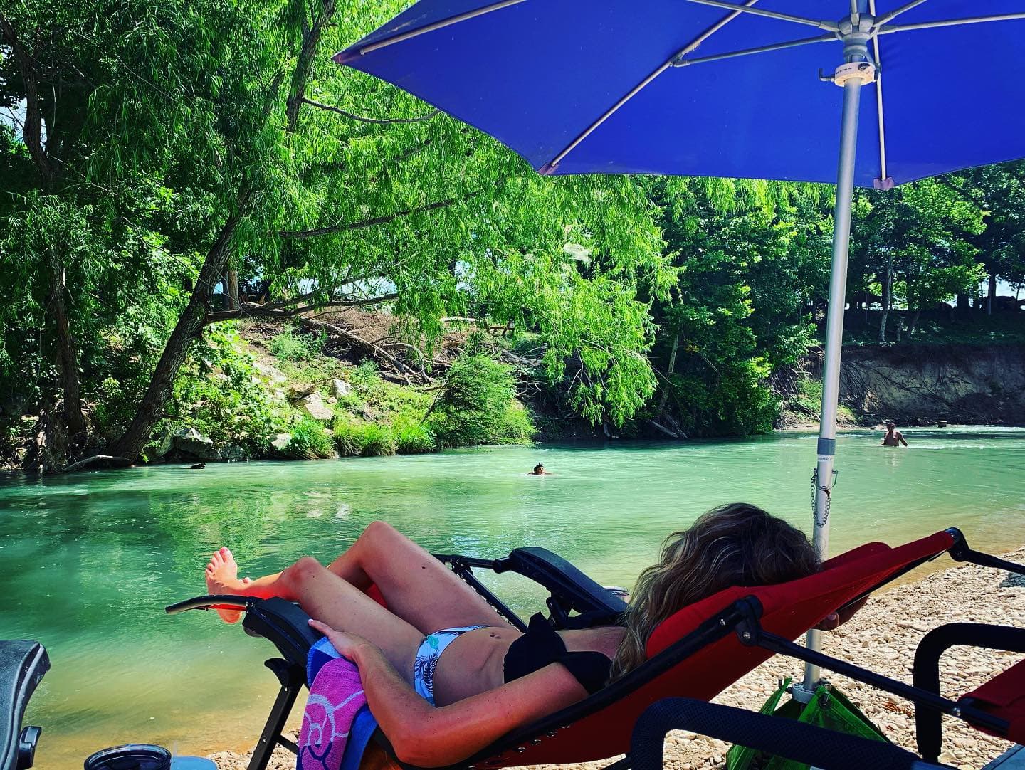 Guests get free use of chairs and umbrellas by the river
