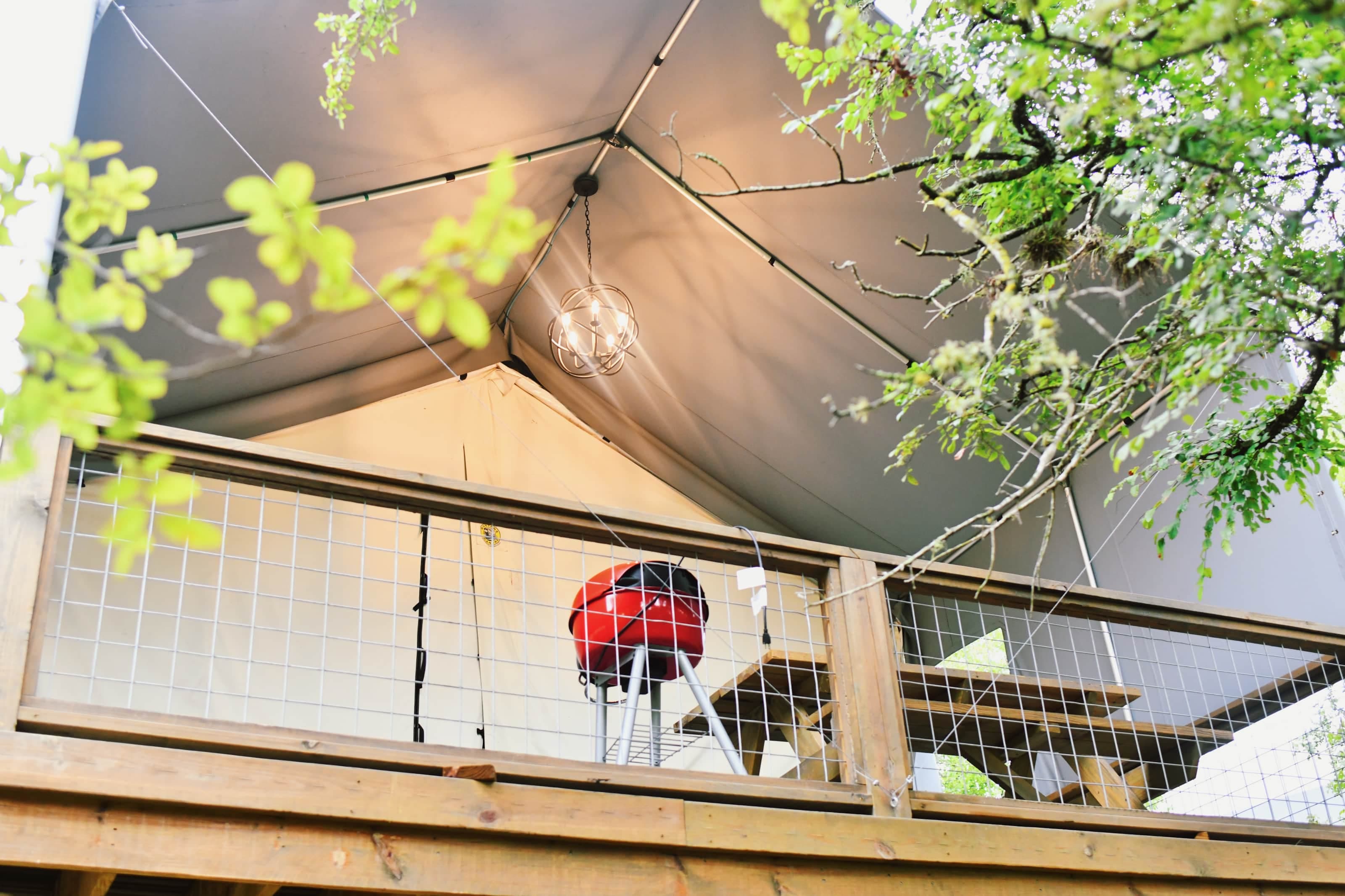Rear deck has comfortable wicker seating, picnic table & BBQ pit