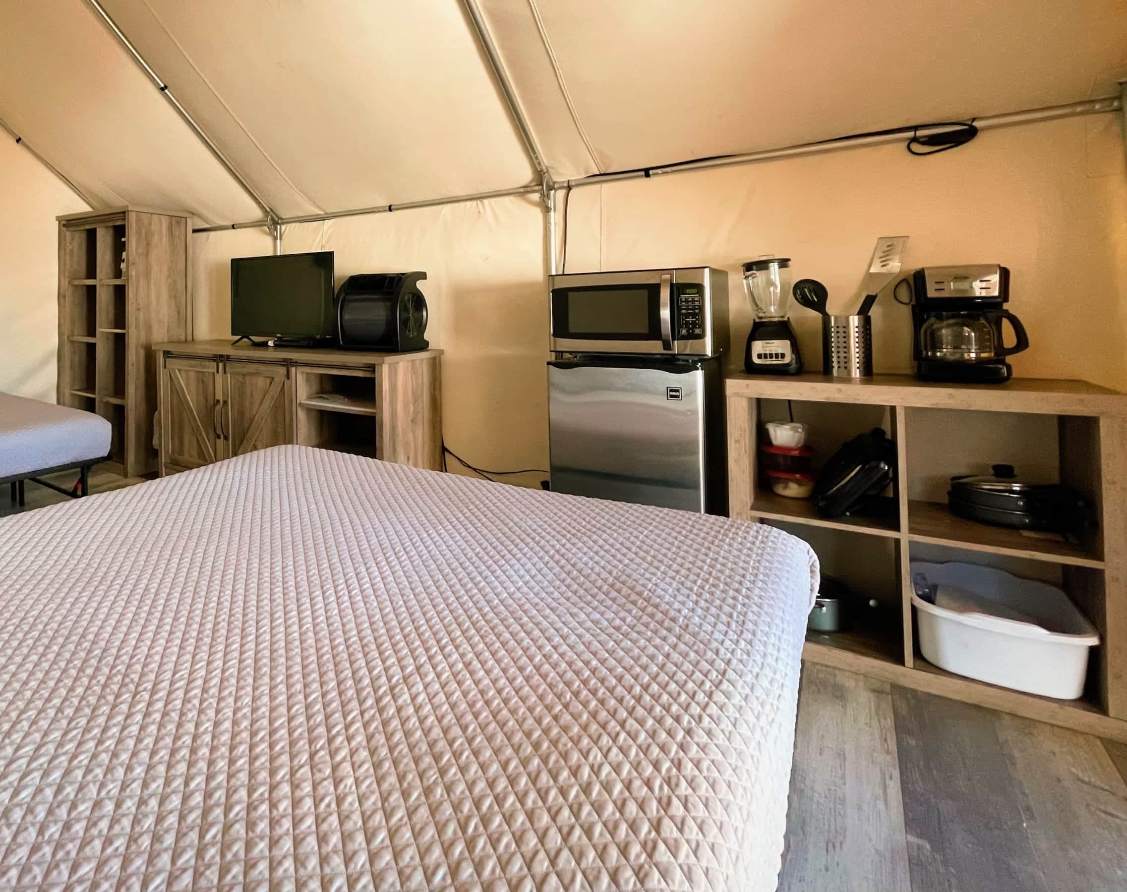 Comes with microwave, mini-fridge, blender, coffee maker, TV, and DVD player.