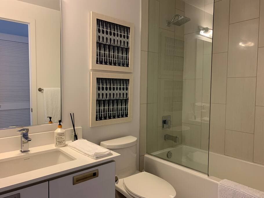 Master Ensuite washroom with tub and shower 