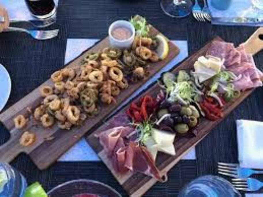 Delicious Beach Club Calamari and assorted cheese, olive, cold cut prosciutto medley