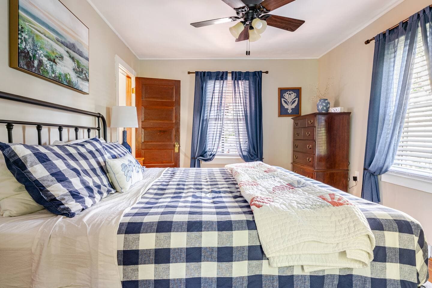 Master bedroom offers a king size bed with his/her closets and his/her dressers. Ceiling fan in master bedroom and is also located next to first floor full bath while being located on the first floor of home.
