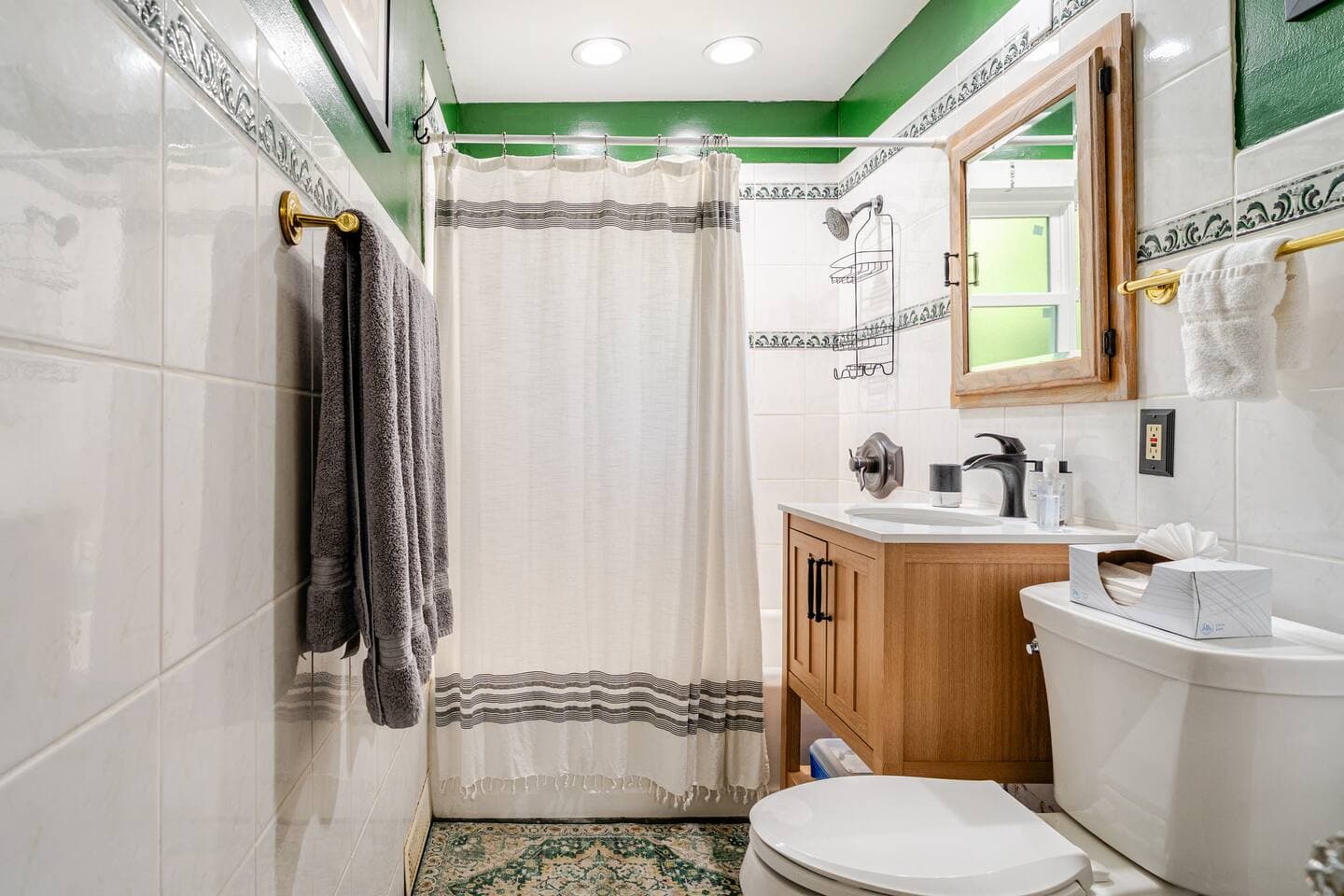 First floor full bathroom hosts new toilet, bath vanity with faucet, and shower trim set. Not private to the master bedroom but adjacent to master bedroom on first floor of home.