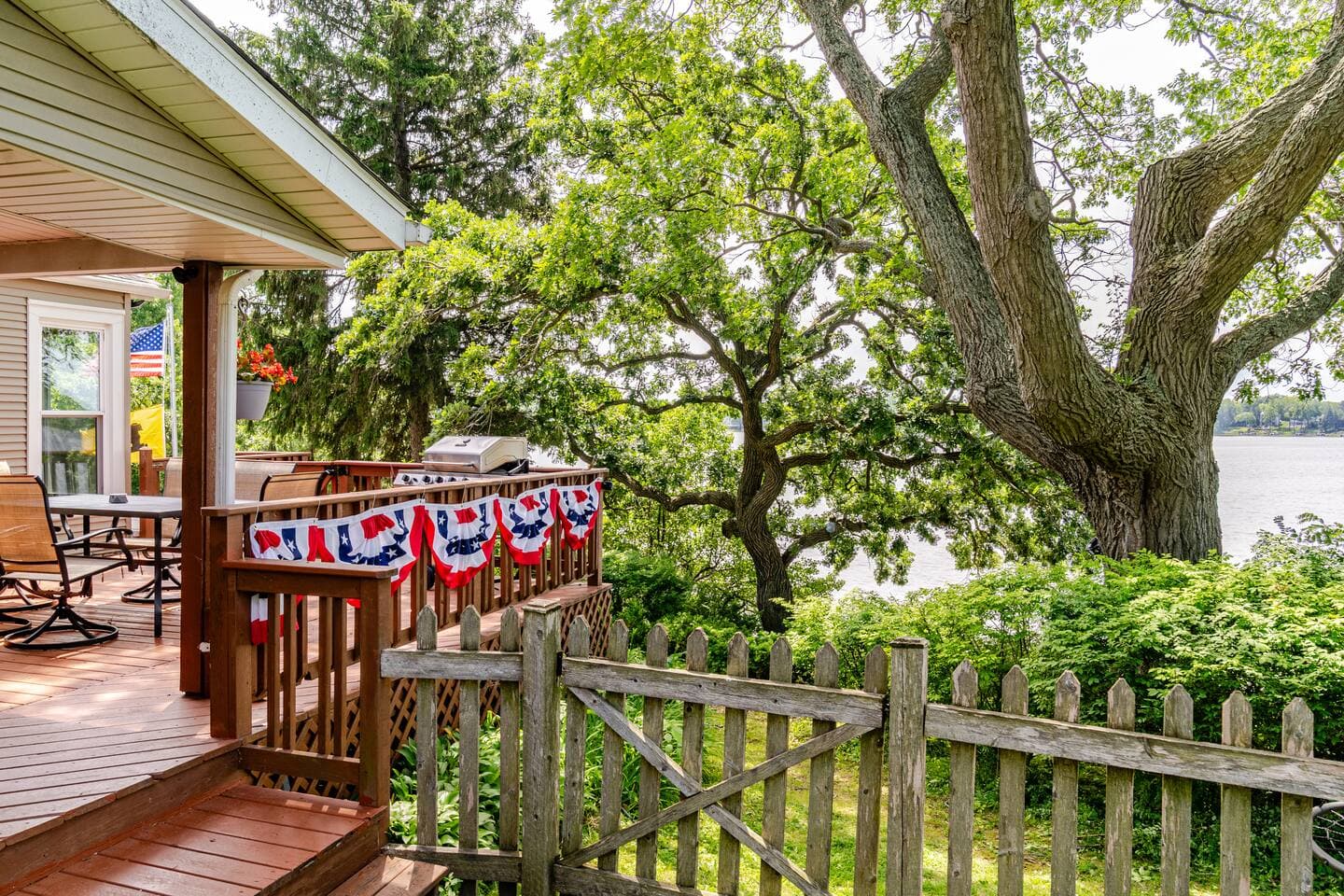View from sideyard on to deck and Bohner's Lake.