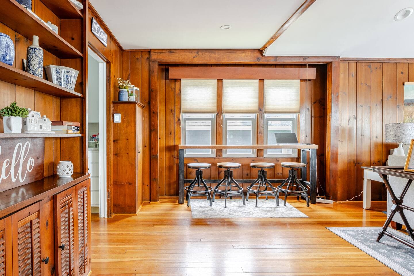 Barstool seating for four in living room.