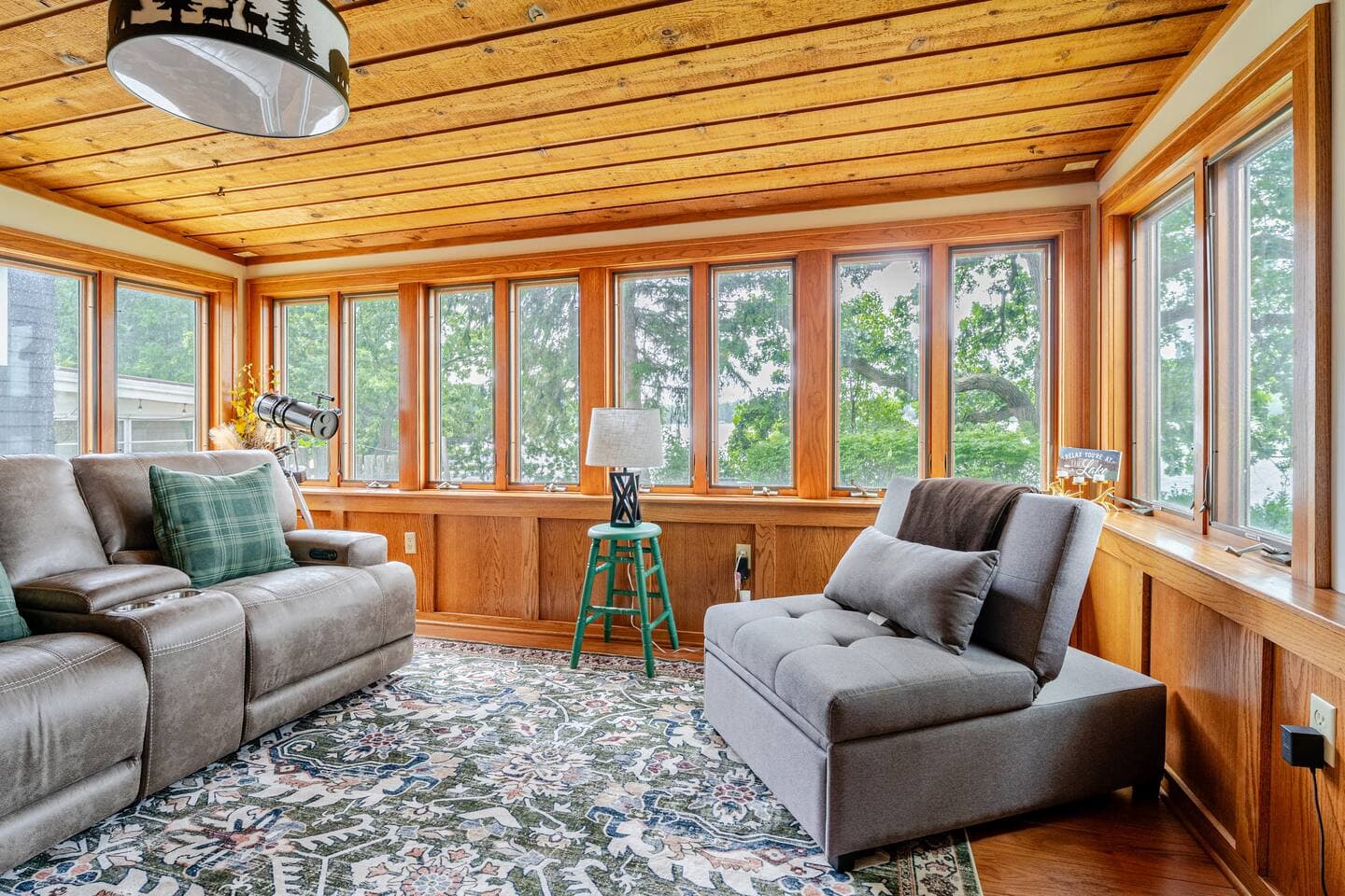 View of lake from Four Seasons Room. Reclining electric chairs (on left) make this my favorite room to take a nap. Futon chair (on right) pulls out to become a twin bed for extra sleeping room.