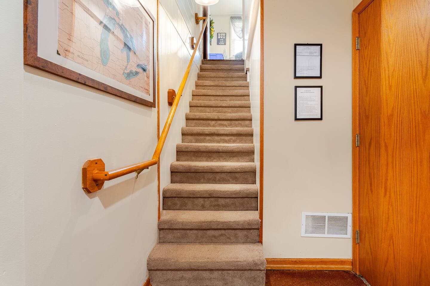 Stairwell leading from Gameroom to Kitchen on first floor.
