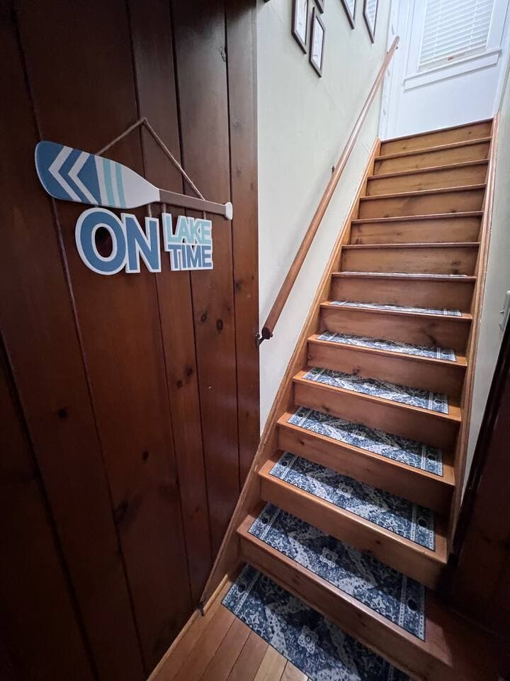 Stairwell leads to 2nd and 3rd bedrooms and hosts a hidden door to block noise from reaching upstairs.