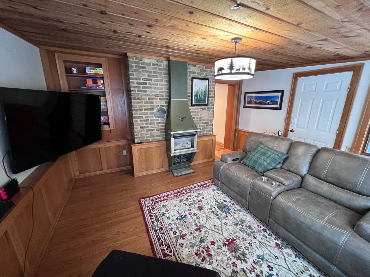 Gas fireplace is operational, but, operates very hot to the touch. Recliners operate by battery and are very comfortable to take a nap in (not considered sleeping area)! Notice, board games on shelving unit.