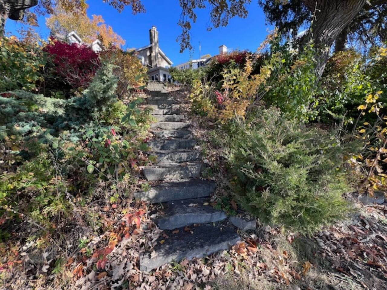 Limestone stairwell from shoreline up to the backyard of home.