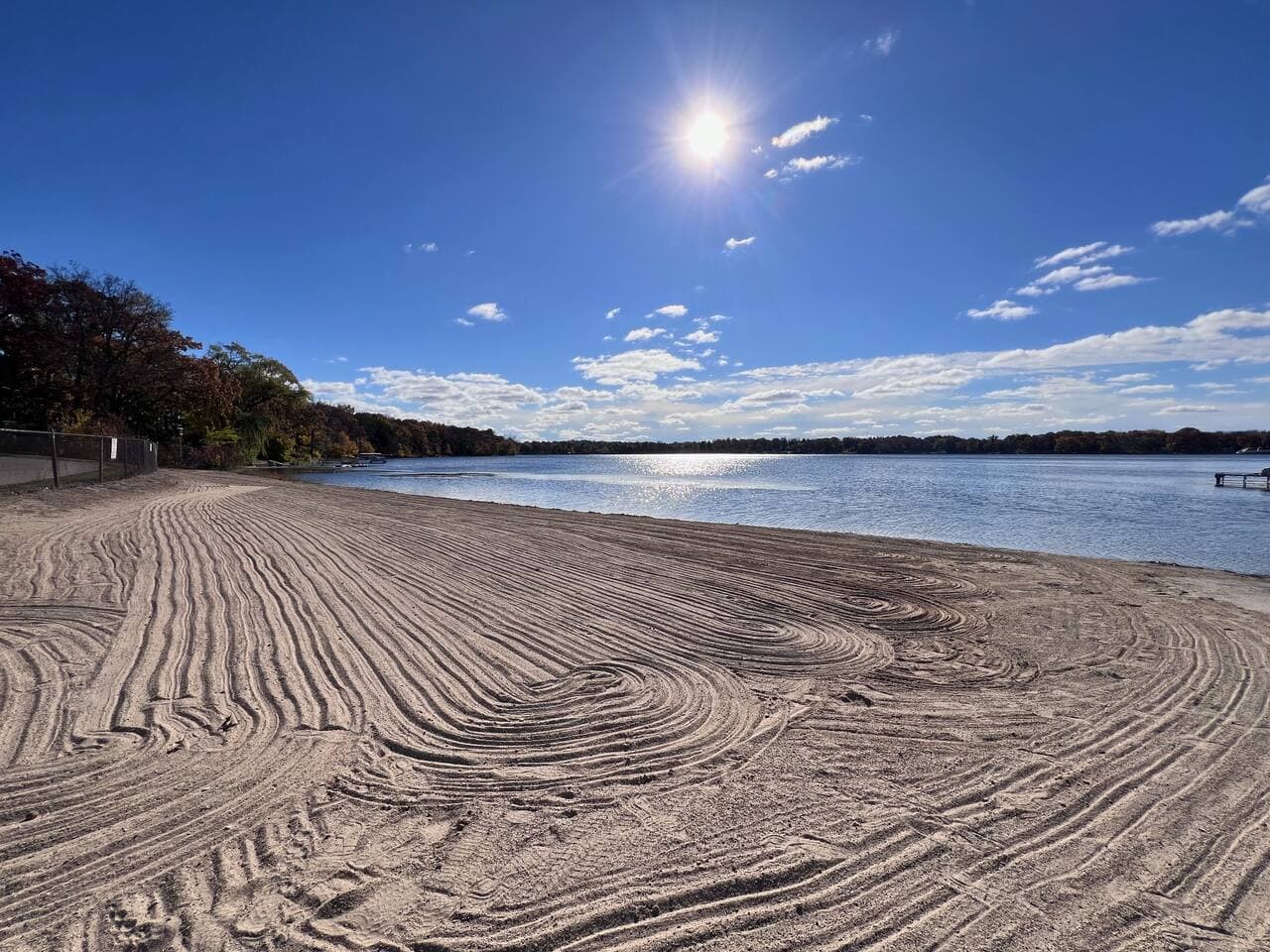 Beach is a five minute walk from home. Also, is the same location you can drop your boat into lake.