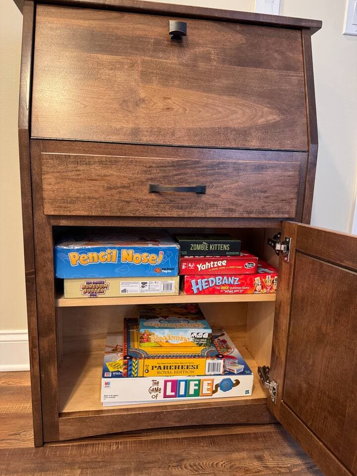 Books and Board games, more items inside the the coffee table. 