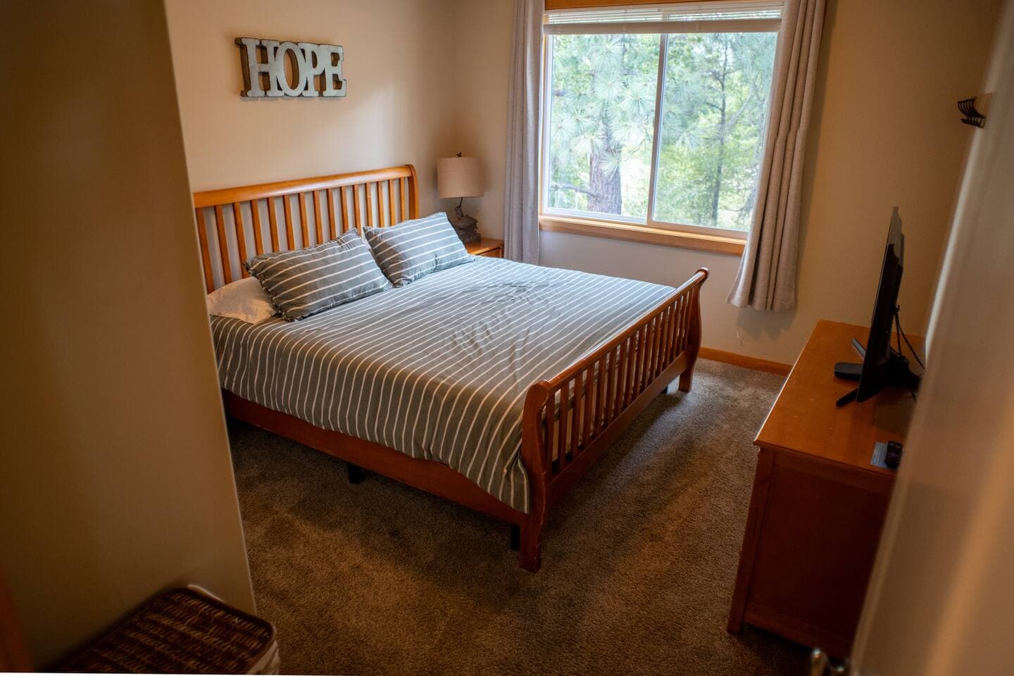 Downstairs king bedroom with nightstands, and bedside 110v and USB outlets for your charging needs.  Smart TV to catch up with your shows from home.