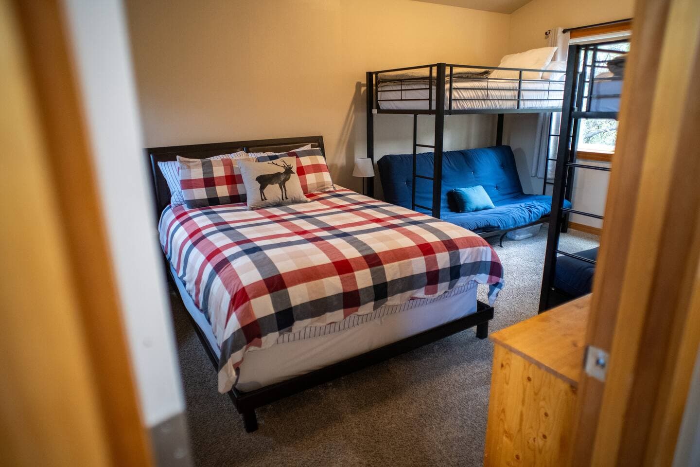 Upstairs bunk room with queen bed