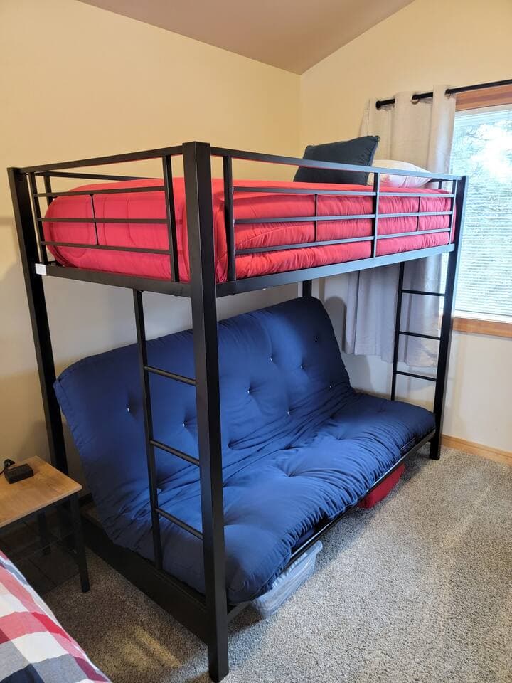 Bunk beds feature a full sized futon on bottom, and a twin on top.  Bedding located under the futon.