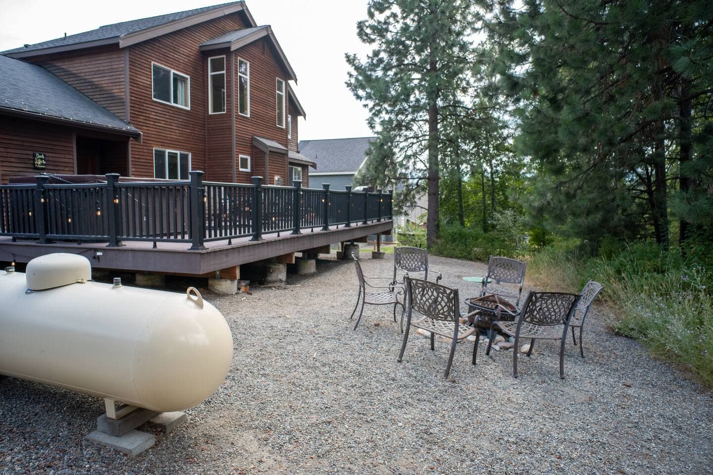 Off the deck, you'll find a seating area around a wood firepit to keep making memories.  Backyard grass area is kept as a meadow, but does have fence surround.