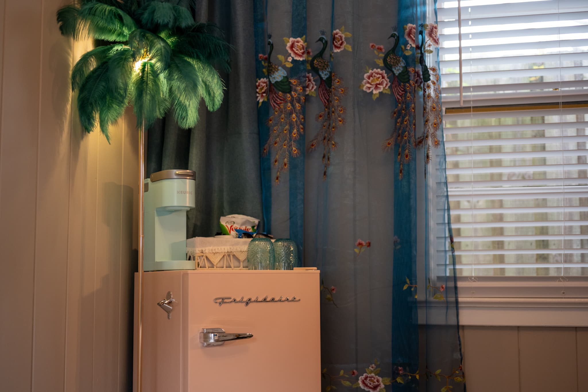 Close Up of Peacock Studio Fridge, Keurig, Snacks