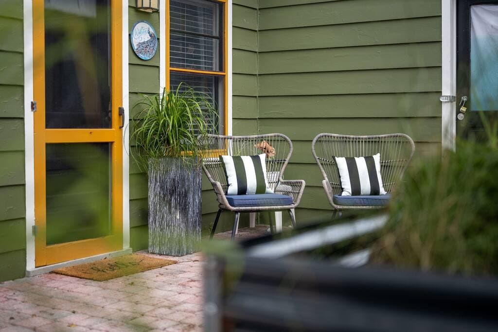 Peacock Studio Entry with Two Patio Chairs