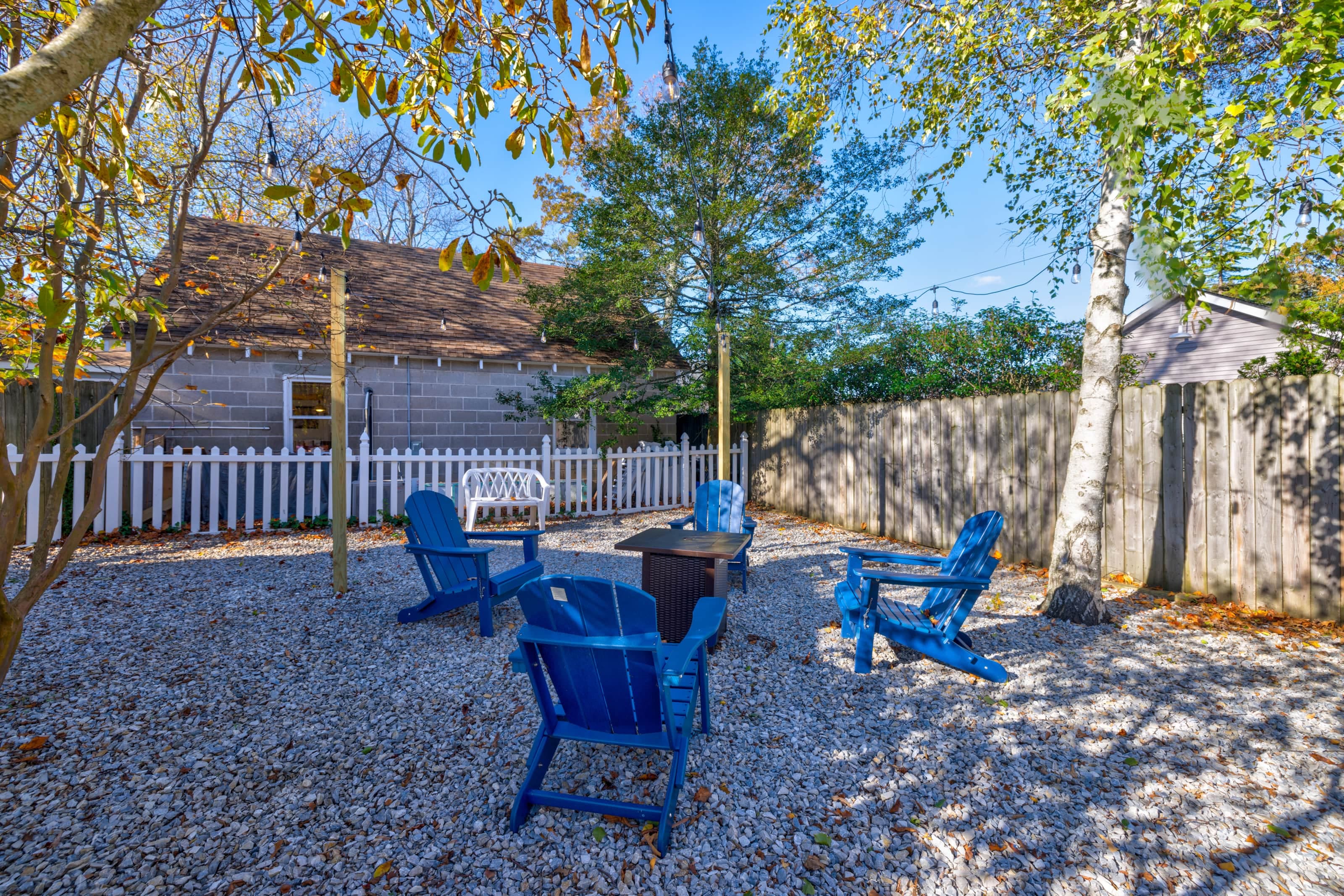 Gas fire pit and Adirondack chairs