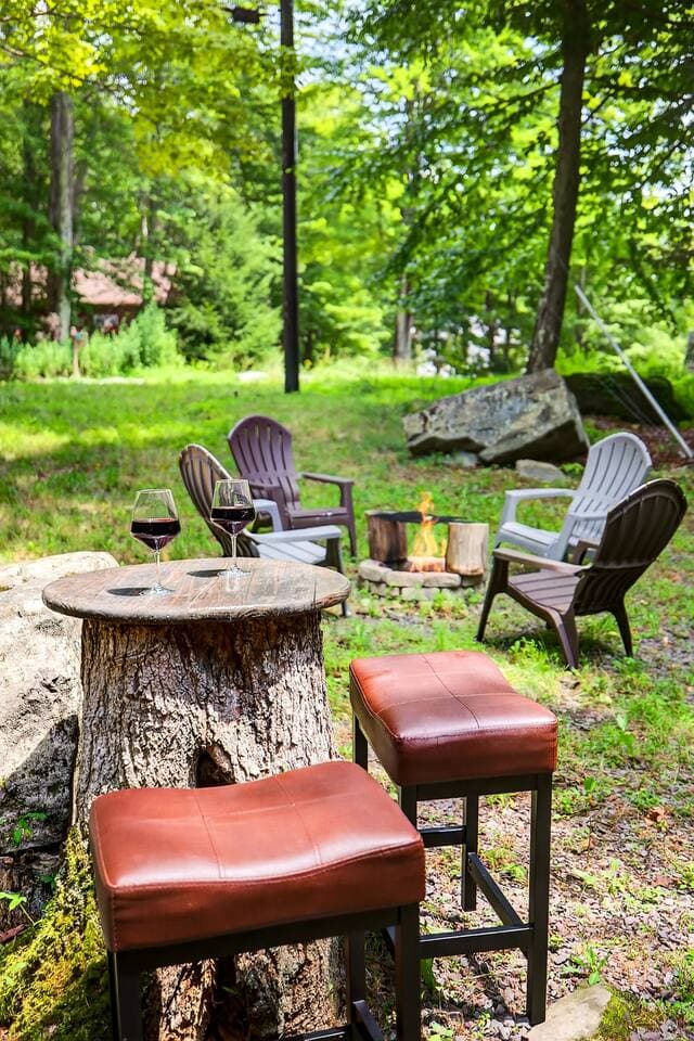 enjoy a glass of wine at the tree stump table
