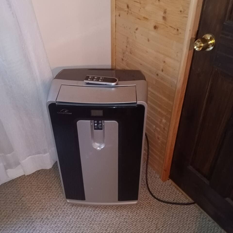 this portable air conditioning unit cools the entire master bedroom and upstairs bathroom