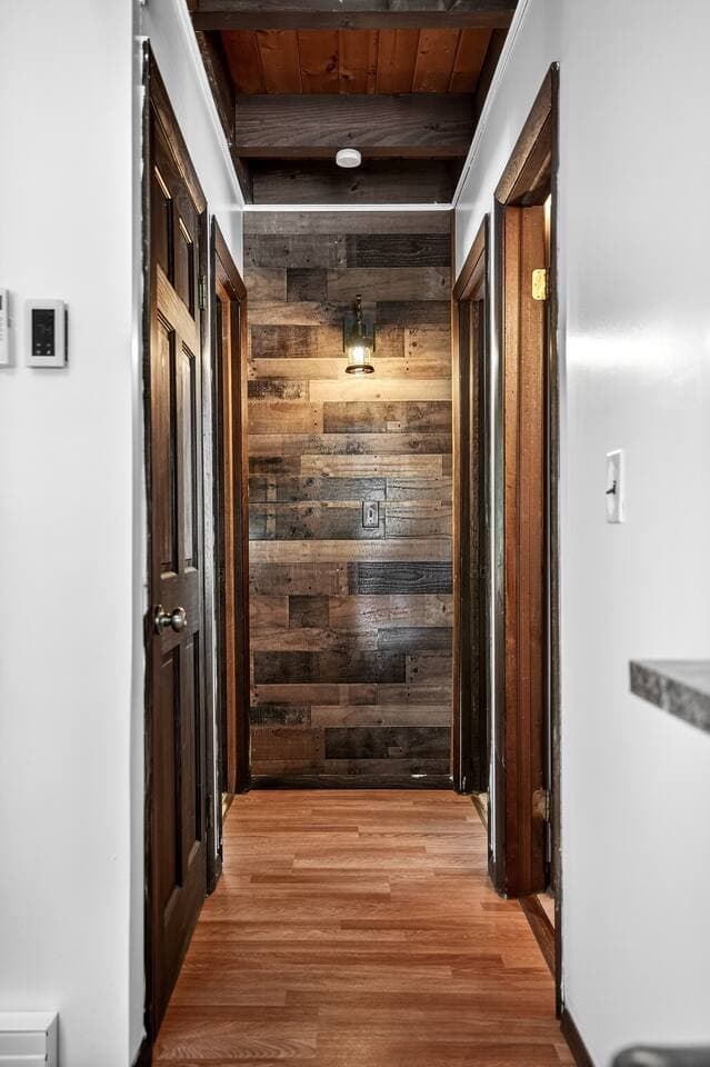 the left door is for the laundry machines first right doors for the downstairs bathroom the last left is the secondary bedroom across from that is the third bedroom